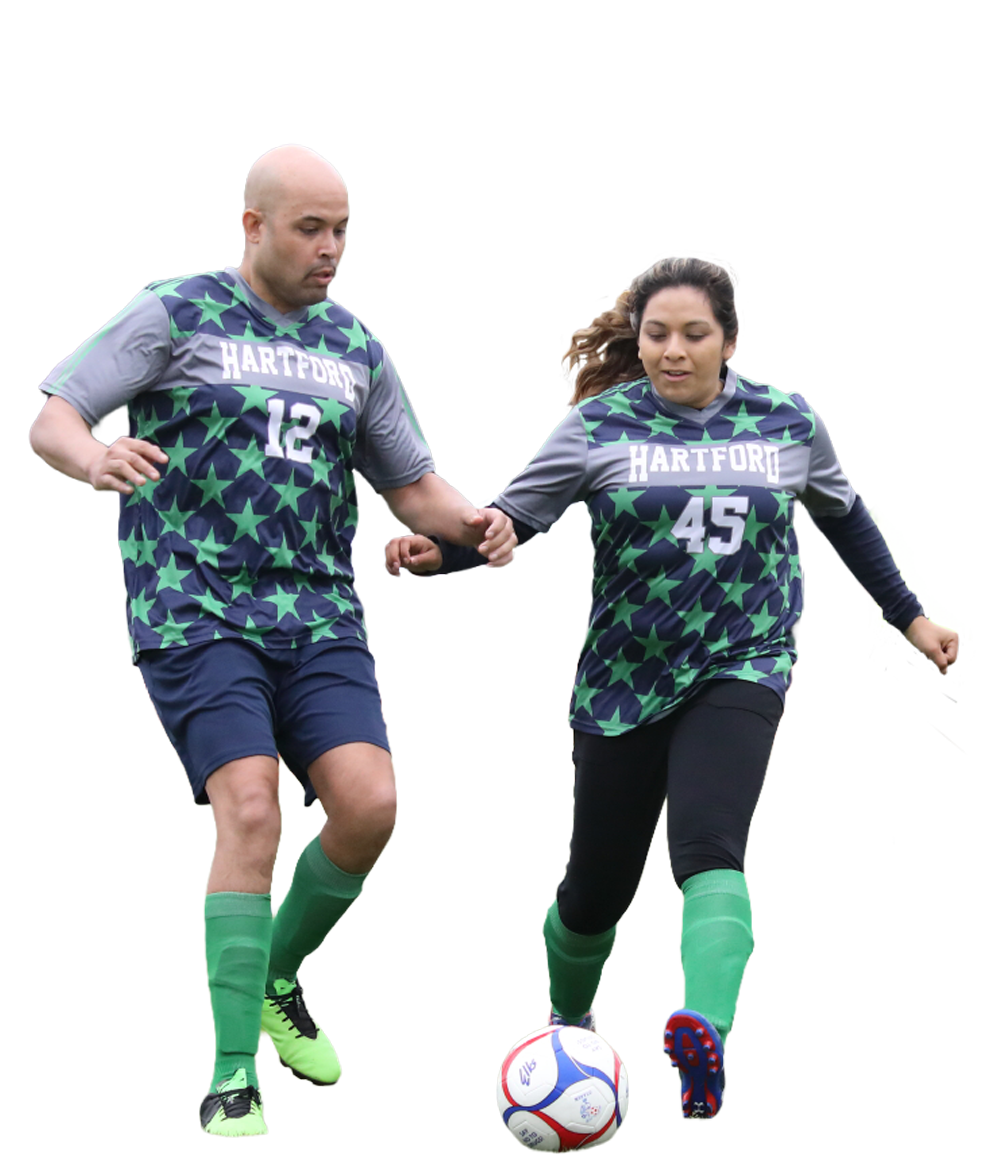 A man and woman playing soccer